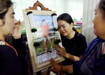 Flowers and toys at funeral for Thai school bus fire victims