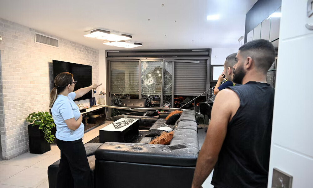  A woman gestures towards the damage in her apartment caused by a rocket fired towards Israel from Lebanon, amid cross-border hostilities between Hezbollah and Israel, in Haifa, Israel, October 7, 2024. Photo: Reuters 