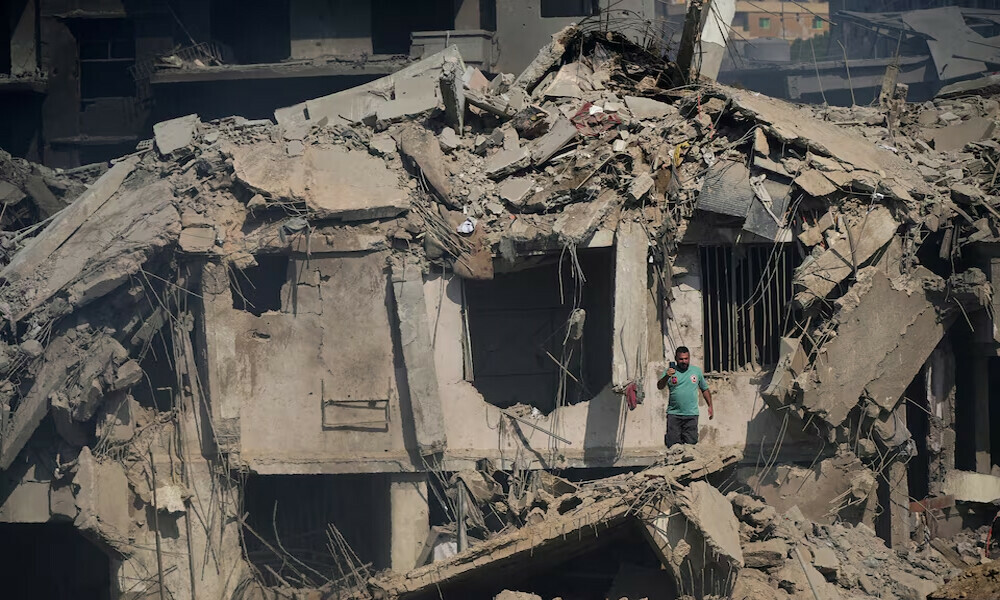  A civil defence member stands amid damage in the aftermath of what security sources said was an Israeli strike on a market, amid the ongoing hostilities between Hezbollah and Israeli forces, in Nabatieh, southern Lebanon, October 13, 2024. Photo: Reuters 