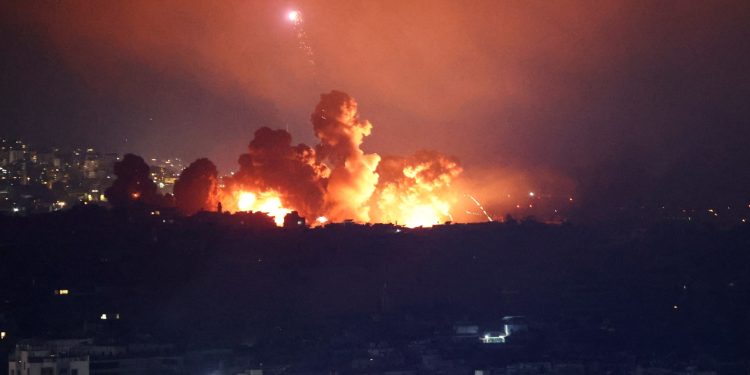 Israel rocks Beirut with huge attack and cuts off main Lebanon-Syria road