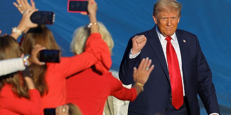 Trump urges supporters to deliver victory in his return to scene of first assassination attempt