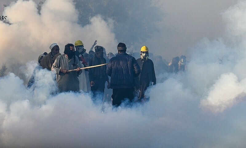  Policemen fire tear gas shells to disperse PTI supporters during a protest to demand the release of former prime minister Imran Khan, in Islamabad on Nov 26, 2024. — AFP 