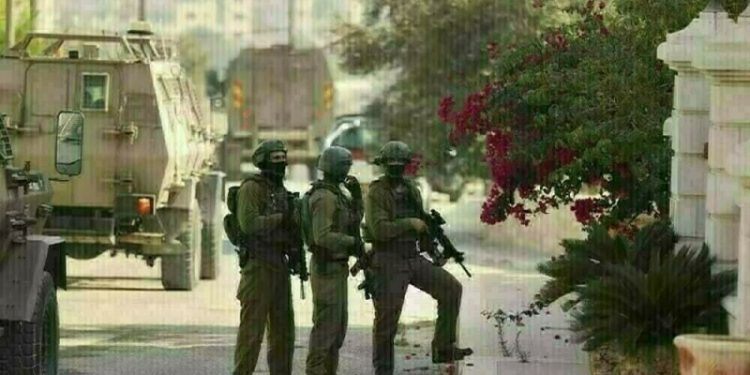 Palestinian officials say Israeli forces kill 2 in West Bank raid