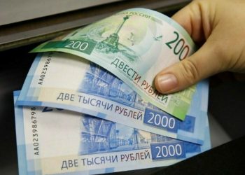Russian rouble strengthens vs dollar in volatile trade