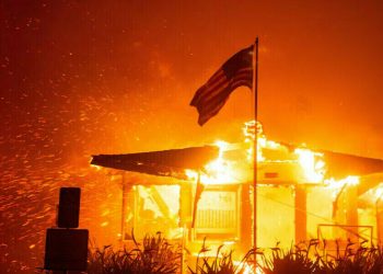 Los Angeles races to contain wildfires before severe winds return