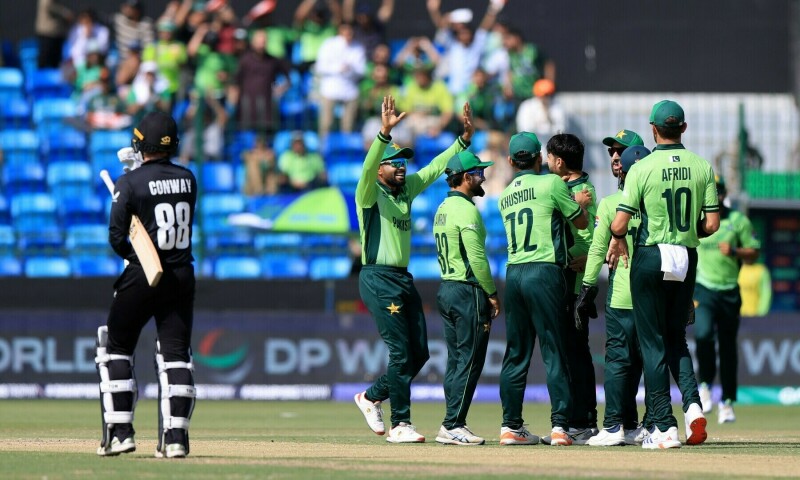 Pakistan’s Abrar Ahmed celebrates with teammates after taking the wicket of New Zealand’s Devon Conway. — Reuters