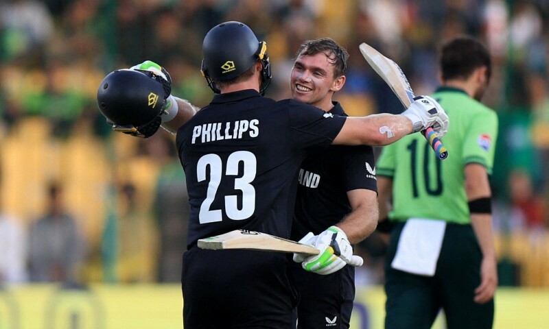 New Zealand’s Tom Latham celebrates reaching his century with Glenn Phillips. — Reuters