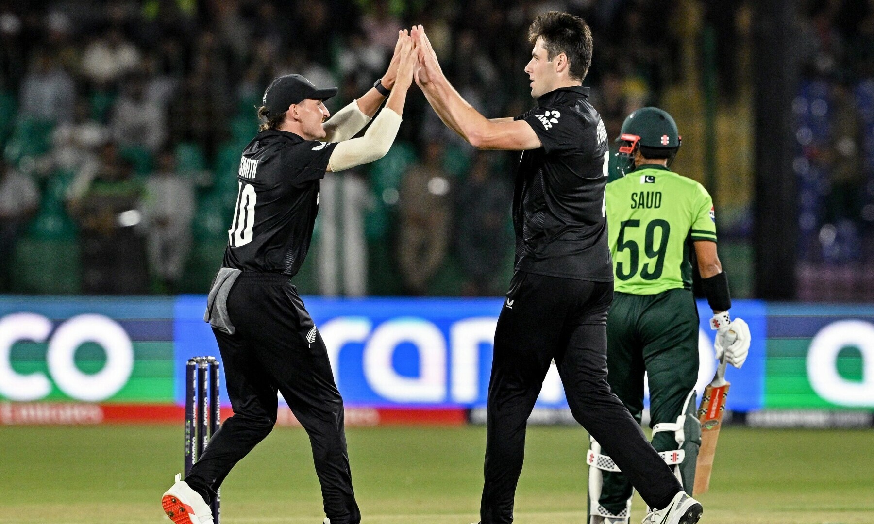  New Zealand’s Will O’Rourke (C) celebrates with Nathan Smith (L) after taking the wicket of Pakistan’s Saud Shakeel during the ICC Champions Trophy cricket match between Pakistan and New Zealand at the National Stadium in Karachi on February 19. — AFP 