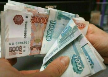 Russian rouble little changed vs US dollar as analysts urge caution