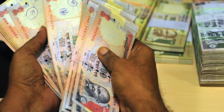 Indian Rupee steady, forward premiums dip as traders await inflation prints