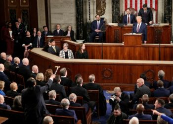 Trump takes victory lap in speech to Congress, Democrats protest