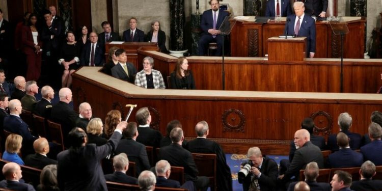 Trump takes victory lap in speech to Congress, Democrats protest