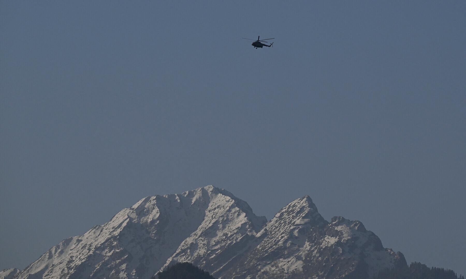  An Indian military helicopter is seen in flight as viewed from Pahalgam, south of Srinagar on April 23, 2025, following an attack. — AFP 