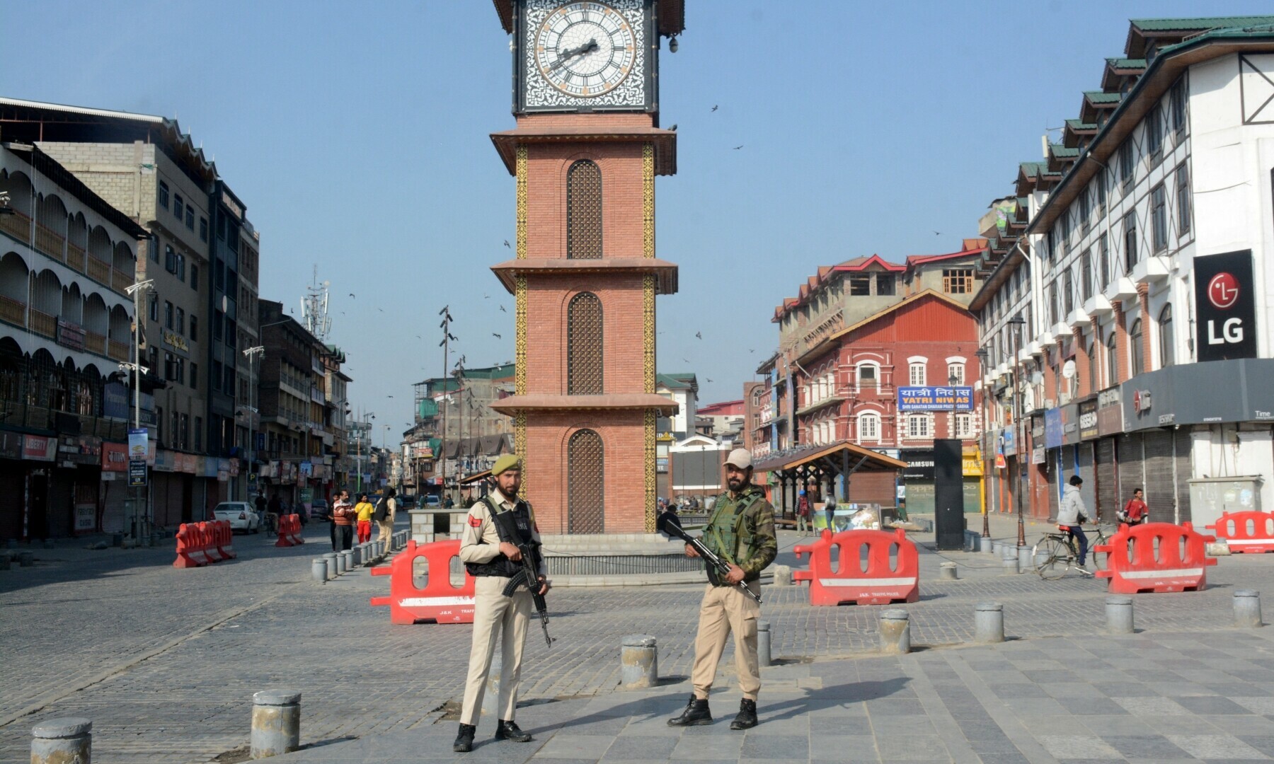  Indian police officers stand guard in front of a clock tower following an attack near south Kashmir’s scenic Pahalgam, at Lal Chowk area in Srinagar on April 23, 2025. — Reuters 