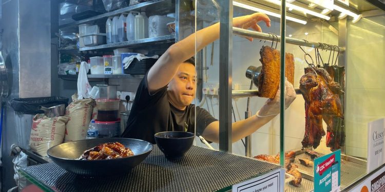 He won a $1 million lottery, then quit his cushy insurance job to open a Cantonese barbequed pork stall. Trading a corporate office for a hot kitchen was harder than he thought.