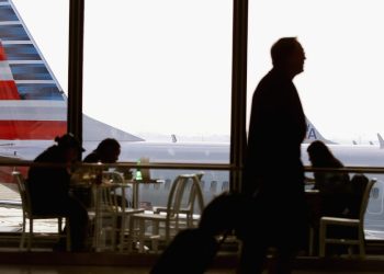 Tariffs are set to make your next flight more expensive &mdash; as airline stocks keep plummeting