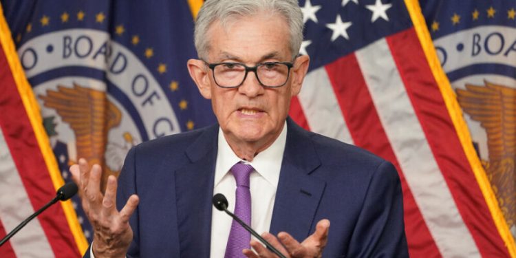 Fed leaves rates unchanged, cites rising risk of higher inflation and unemployment