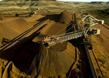 Iron ore rises on softer US dollar, steady demand