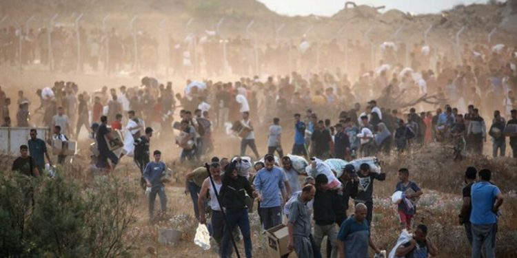 Gaza civil defence says 15 killed near aid centre, army says fired ‘warning shots’