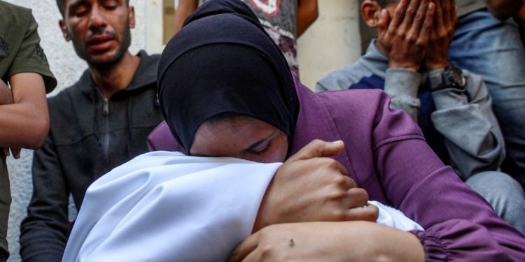 Israeli attacks in Gaza kill more than 70, including several near aid site