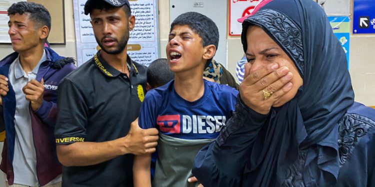 Rescuers say Israeli fire kills at least 27 near Gaza aid point