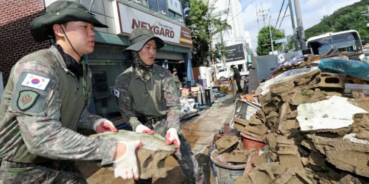 Death toll rises to 14 in South Korea as heavy rain triggers landslide and flooding