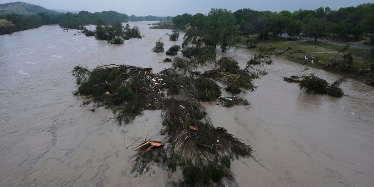 Photos show Texas floods and rescue efforts; one girls' camp said its director is among the dead