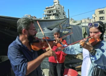 ahmed abu amsha conducts a music lesson photo reuters