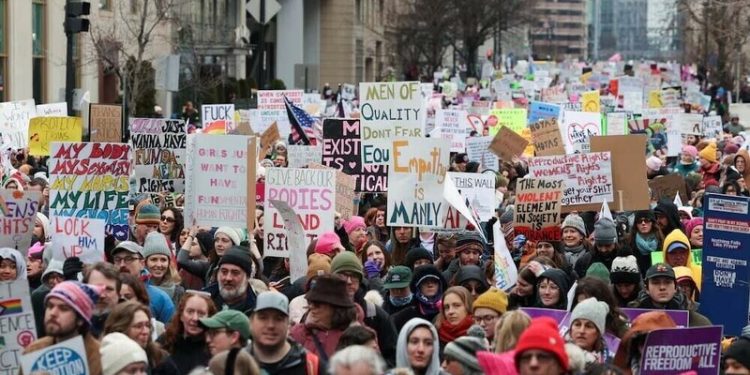 Anti-Trump protesters march through London as president basks in royal welcome