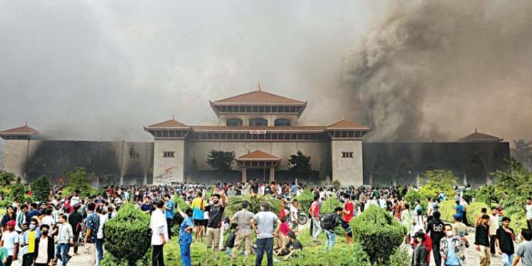 Nepali protesters set parliament ablaze as PM quits