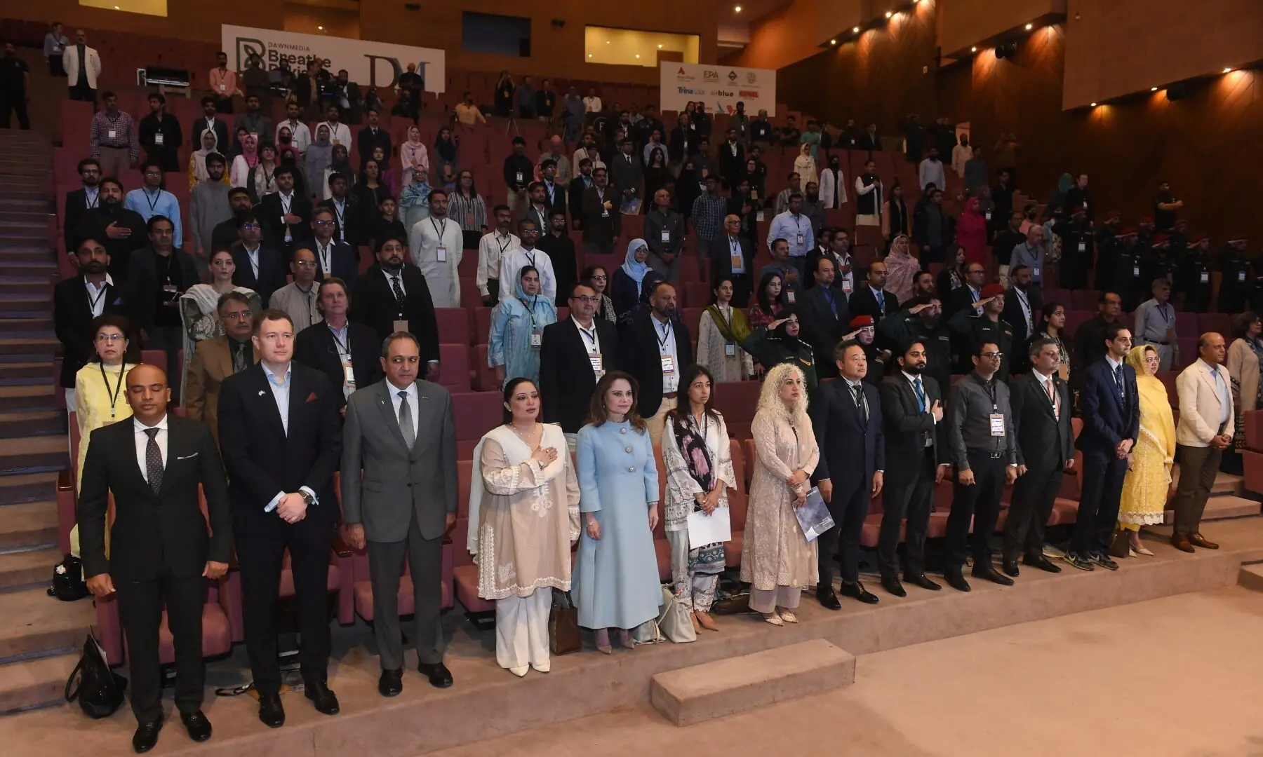  Participants rise for the national anthem. — Murtaza Ali / White Star 