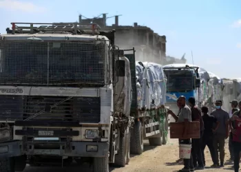 Aid trucks roll into Gaza as dispute over hostage bodies is paused