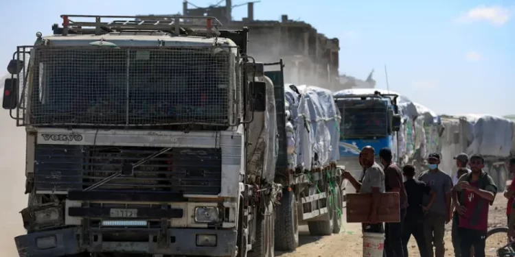 Aid trucks roll into Gaza as dispute over hostage bodies is paused