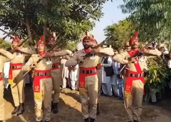 Soldiers perform a gun salute at the funeral of two soldiers in Gujar Khan on October 13. — Hamid Asghar