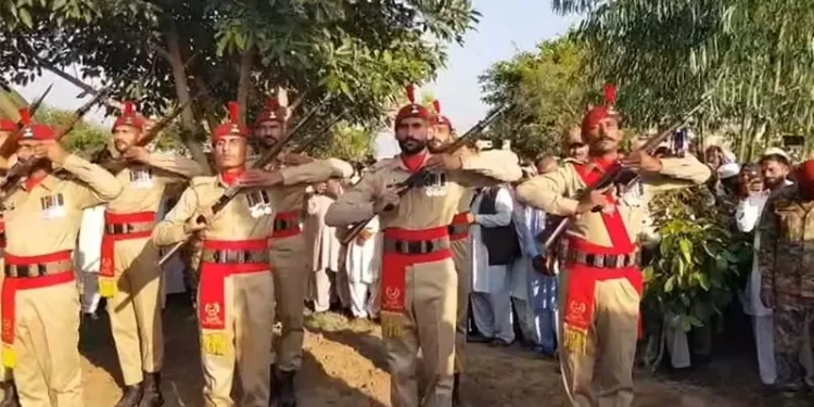 Soldiers perform a gun salute at the funeral of two soldiers in Gujar Khan on October 13. — Hamid Asghar