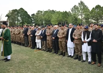Military and civilian officials offer funeral prayers for two officers martyred during an operation in KP’s Orakzai area in Rawalpindi on October 10. — Photo courtesy ISPR
