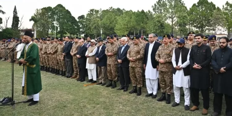 Military and civilian officials offer funeral prayers for two officers martyred during an operation in KP’s Orakzai area in Rawalpindi on October 10. — Photo courtesy ISPR