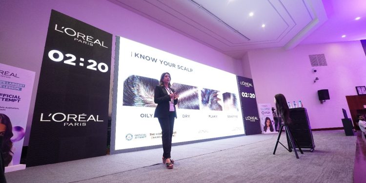 A person speaking in front of a large screen

AI-generated content may be incorrect.