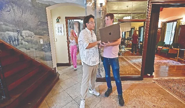 french taiwanese producer vincent wang and line producer kyle vertin talk while filming love through all seasons at the wrensmoor castle in california photo afp