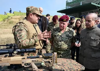 Jordan’s King Abdullah II, accompanied by Prime Minister Shehbaz Sharif, is shown a sniper rifle at the Tilla Fields firing range near Jhelum on November 16. — Photo courtesy ISPR