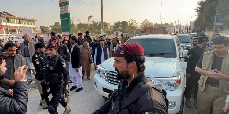 Police commandos escort a vehicle carrying KP Chief Minister Sohail Afridi near Adiala Jail in Rawalpindi on November 27. — Reuters