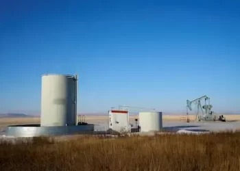 Oil climbs after hitting one-month low; supply glut weighs