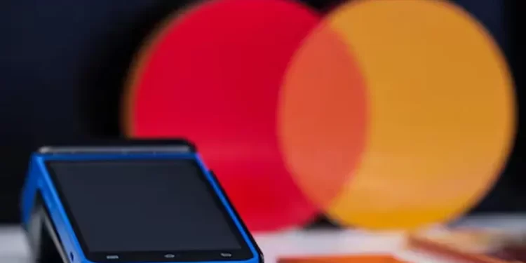 Visa and Mastercard near settlement with merchants, would lower fees, WSJ reports