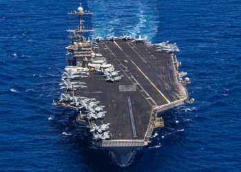 A US aircraft carrier's hard turn to avoid enemy fire surprised sailors and sent a jet with bad brakes into the sea
