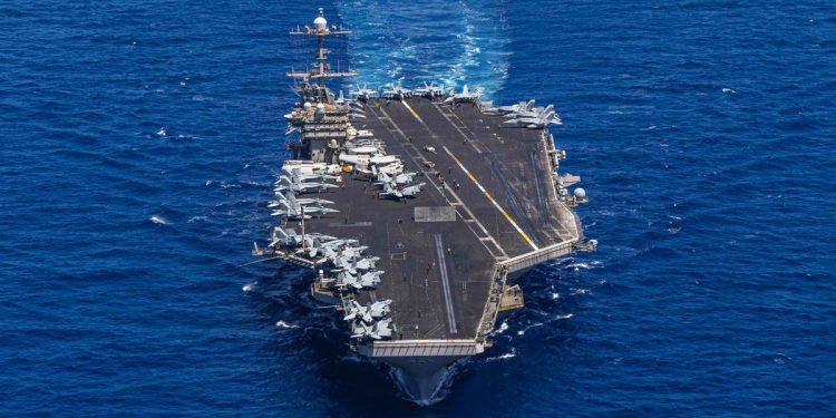 A US aircraft carrier's hard turn to avoid enemy fire surprised sailors and sent a jet with bad brakes into the sea