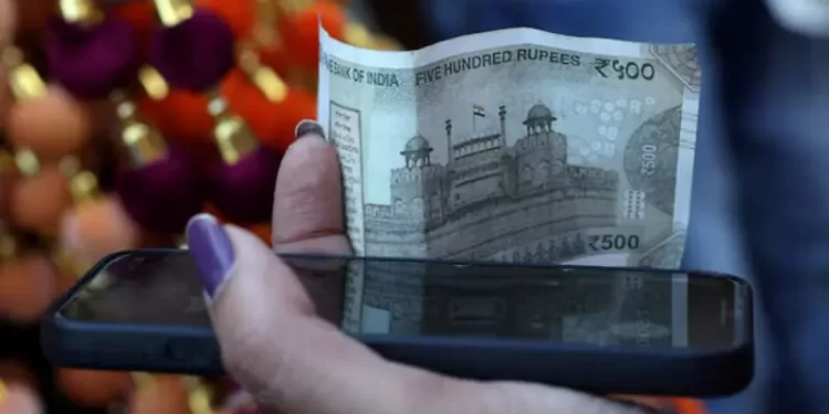 Indian rupee weakens as corporate dollar outflows eclipse Fed boost