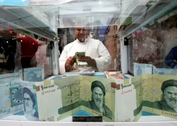 Iran’s currency sinks to a new record low