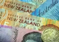 Kiwi dollar, market rates fall as RBNZ chief warns financial conditions tightening