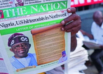 people read newspapers reporting on us airstrikes against islamic state militants in lagos nigeria photo reuters