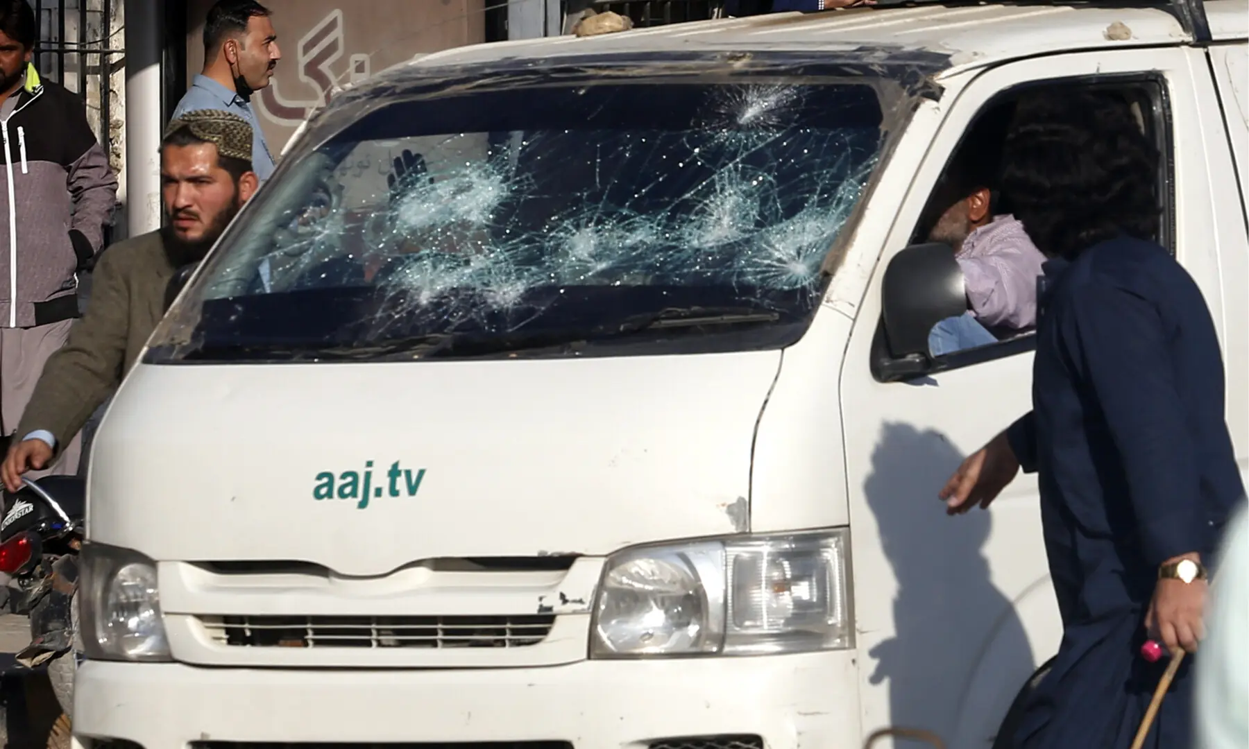  A vehicle of Aaj News with a badly damaged windshield. &mdash; Shakil Adil/ White Star 